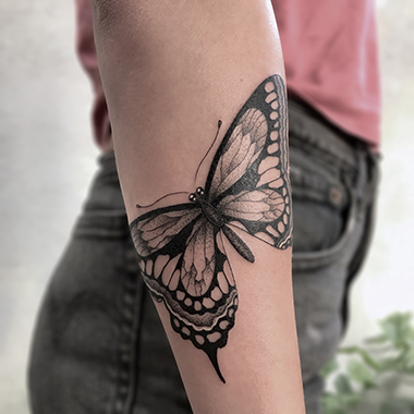blackwork butterfly tattoo
