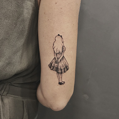 blackwork Alice tattoo