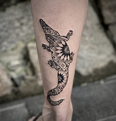blackwork crocodile tattoo