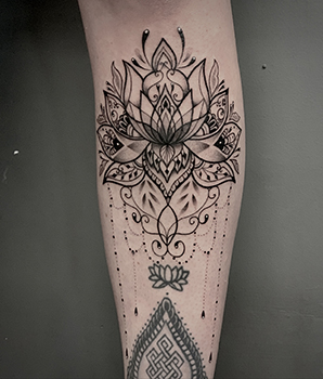 blackwork lotus tattoo