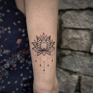 blackwork lotus tattoo