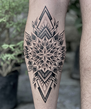 blackwork mandala tattoo