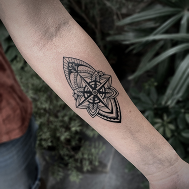 blackwork symbol tattoo