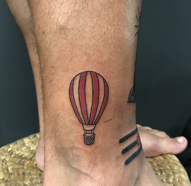 colored air balloon tattoo
