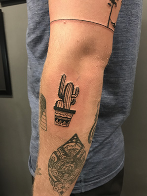 cactus blackwork tattoo on arm