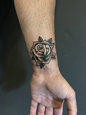 oldschool flower tattoo on wrist