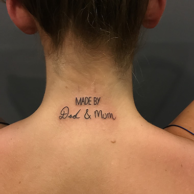 Letters tattoo on neck