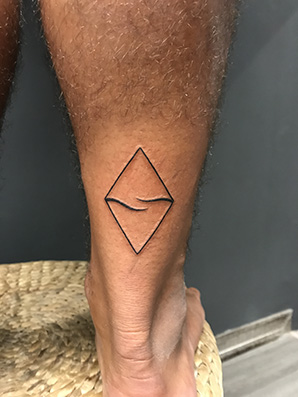 minimalist symbol tattoo