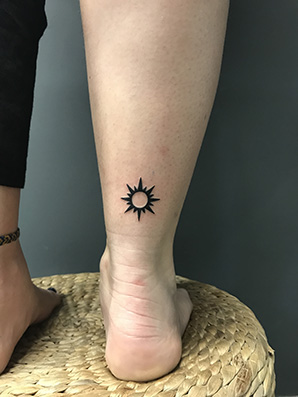 tattoo of the sun