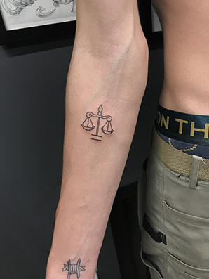 symbol of justice tattoo