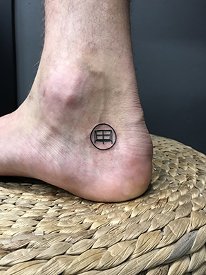 symbol tattoo on ankle