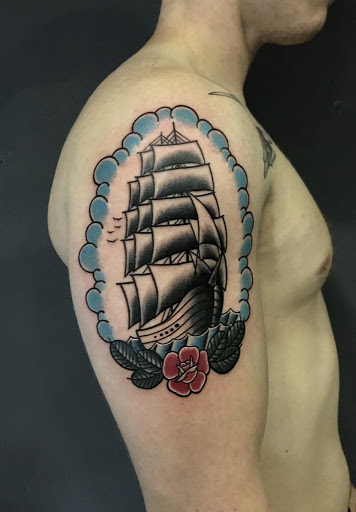 Arm tattooed in traditional style  Tattoogridnet