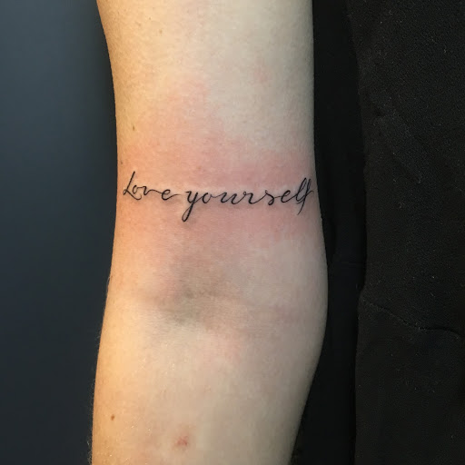 Portrait of a beautiful woman with a tattoo on Craiyon