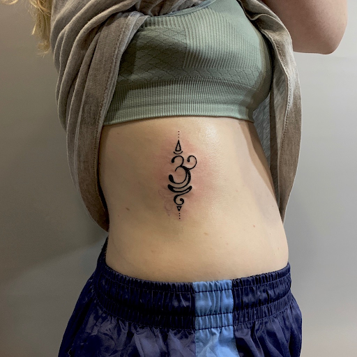 Lotus tattoo with om symbol meaning and design