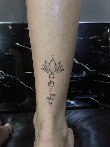 Lotus tattoo with om symbol meaning and design