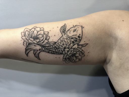The true meaning of koi fish and lotus flower tattoo - 1984 Studio