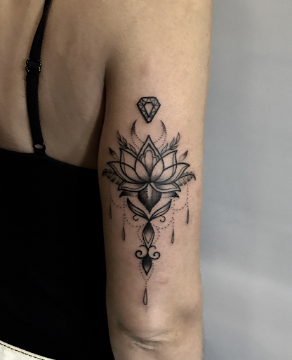 Twisting it: geometric lotus tattoo versus watercolor lotus tattoo