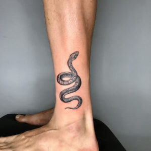 Marvelous snake tattoo - Origin, meaning, and ideas