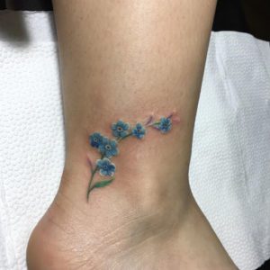 Forgetmenot flowers  memento mori lettering tattoo
