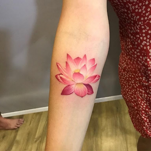 graceful lotus symbol tattoo for girls