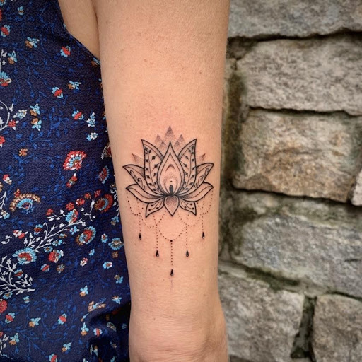 graceful lotus symbol tattoo for girls