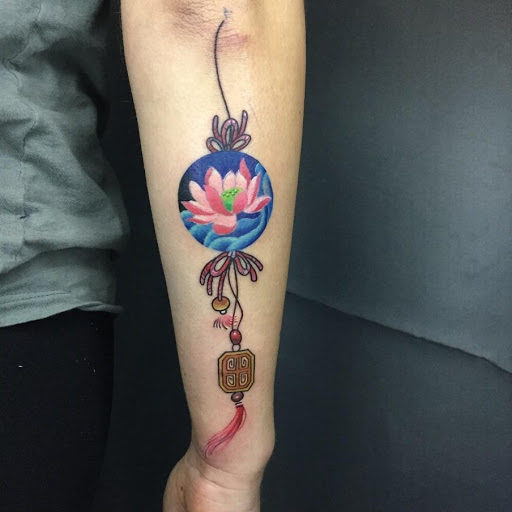 graceful lotus symbol tattoo for girls