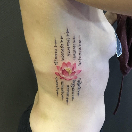 graceful lotus symbol tattoo for girls