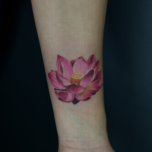 graceful lotus symbol tattoo for girls