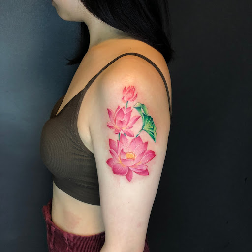graceful lotus symbol tattoo for girls