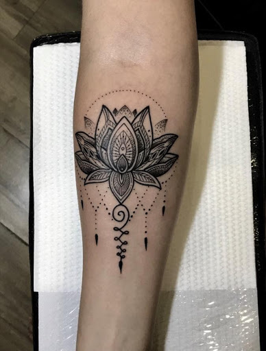 Masculine lotus flower tattoo men