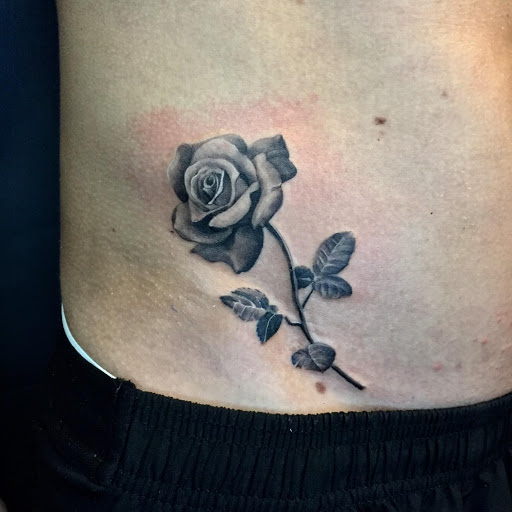 Black And Grey Rib Cage Rose Tattoo by Capone: TattooNOW